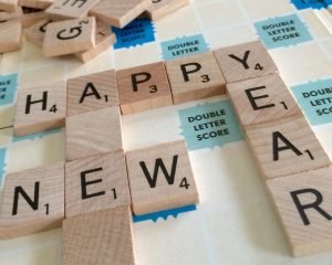 Scrabbles tiles spelling out Happy New Year - The secret to keeping your new near's resolutions - Adventures in NanaLand