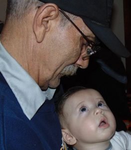 grandfather holding grandson - Adventures in NanaLand - Becoming a grandparent