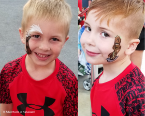 Boys with matching red shirts and face painting - Planning a Trip to Disneyland - Adventures in NanaLand
