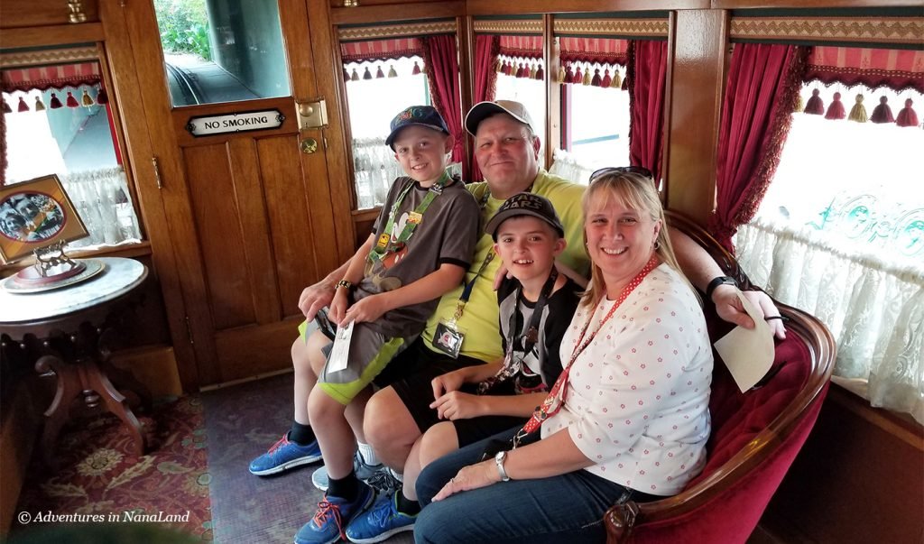 Grandparents and grandchildren in the Lilly Belle Car of the Disneyland Railroad Train - Beating the Disneyland Crowds - Adventures in NanaLand