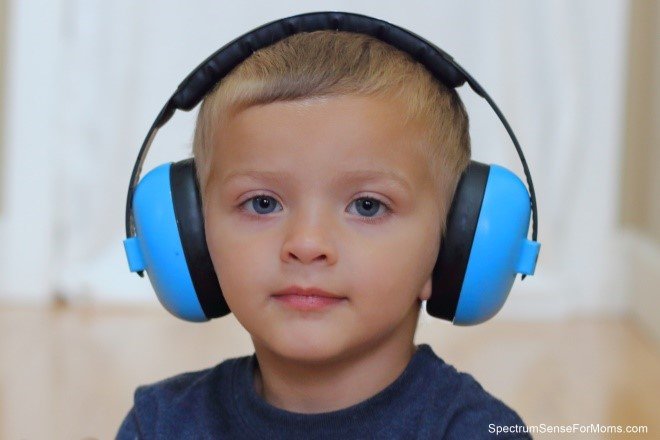 Boy with large blue headphones on - Special needs grandchildren - Adventures in NanaLand