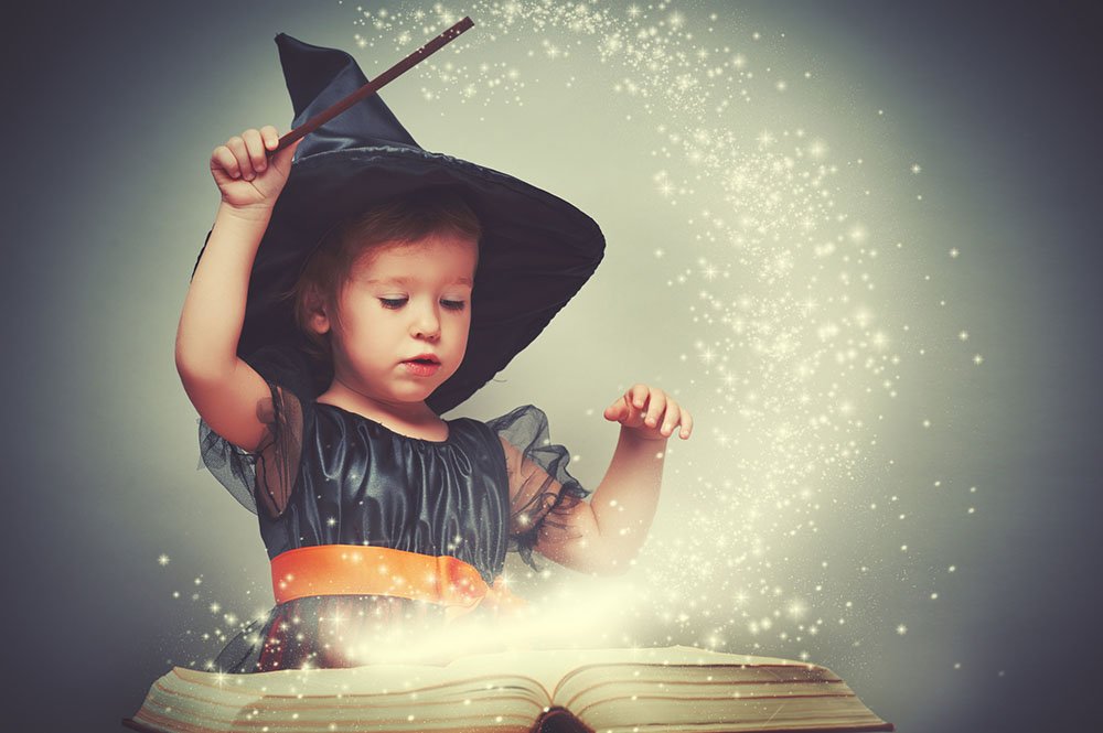 Little girl in witch Halloween costume - Halloween Care Package for Grandkids - Adventures in NanaLand