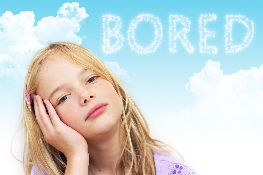 Girl with head in hand with bored spelled out in the clouds above her - Boredom Busters for Grandmas House - Adventures in NanaLand