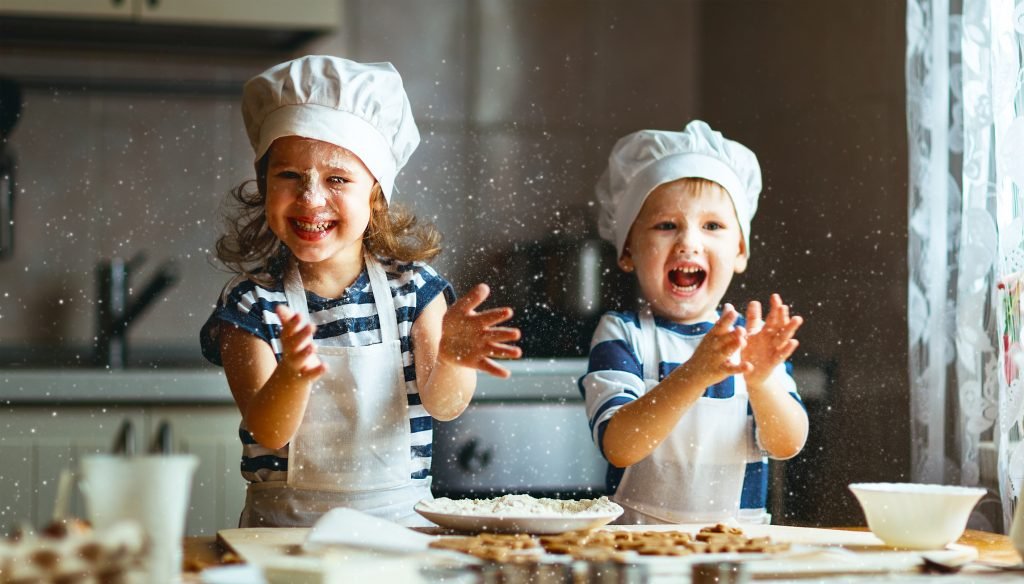 Boy and girl baking in kitchen, happy kids in chef hats, cooking subscription boxes for kids, Adventures in NanaLand